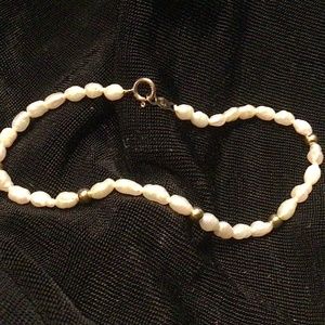 Perfect 7” bracelet of delicate freshwater pearls & tiny 14K gold clasp.